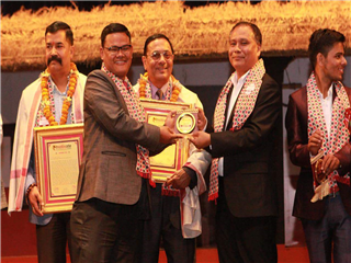 Receiving Letter of Appreciation from Kul Man Ghising